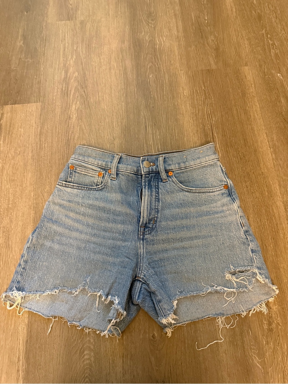 Madewell light wash distressed jean shorts